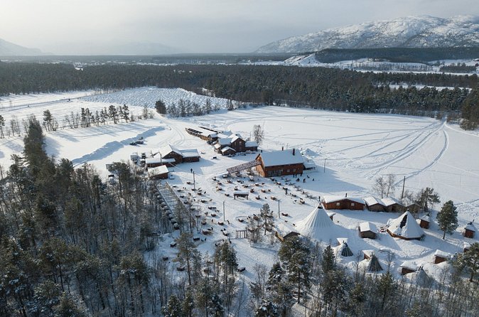 Dog Sled Tour and Husky Cuddles - Warming up in a traditional Sámi lavvu