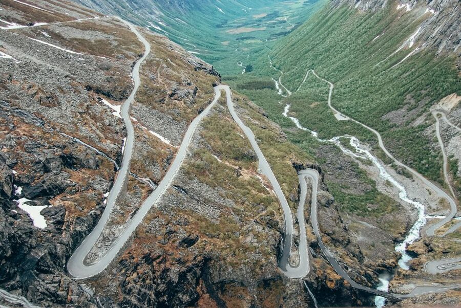 From Ålesund: Trollstigen Sightseeing Village & Fjord Tour - Troll Wall and the ride into Åndalsnes