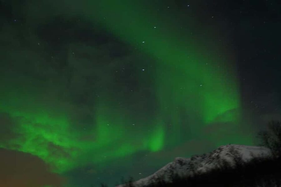 From Tromsø: Aurora Bus Tour with Snacks, Photos, and Drinks - Leaving Tromsø for a darker Arctic sky