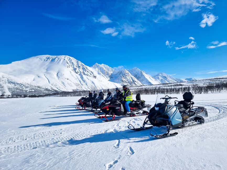 From Tromsø: Lyngen Alps Guided Snowmobile Tour - Riding a shared snowmobile through mountain country