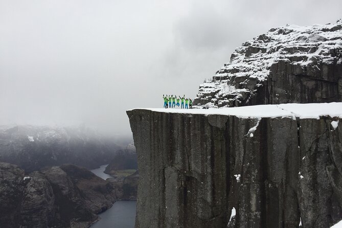 Guided winter hike to Pulpit Rock Preikestolen - Reaching the flat rock above Lysefjord