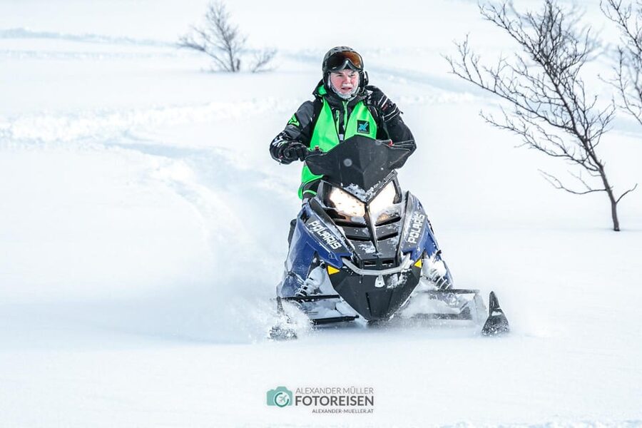 Lyngen: Snowmobile Safari with Lunch in seaside Restaurant - Riding through the Lyngen Alps