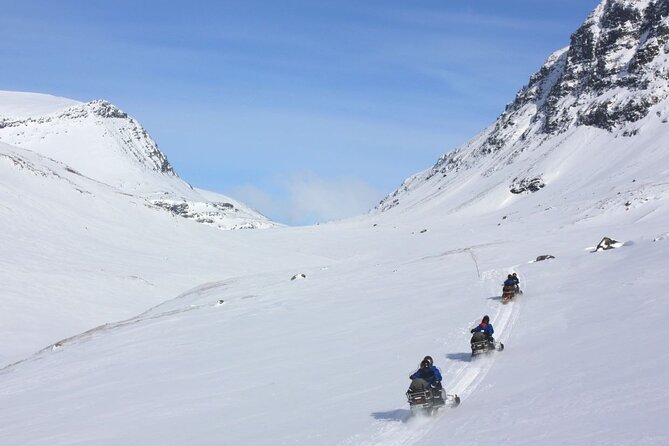 Snowmobile Evening Adventure outside Tromsø - Riding through the dark Arctic valley