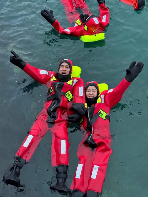 Tromsø: Arctic Fjord Floating in Survival Suit - Meeting at Magic Ice Bar and riding to Kaldfjord