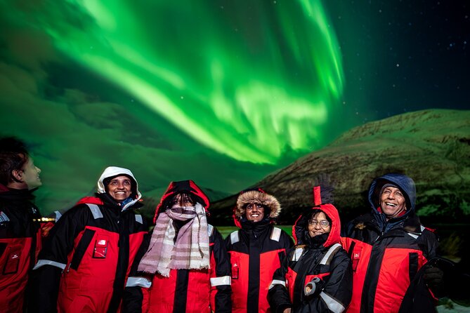 Tromsø: Northern Lights by Minibus - Free Photos and Warm Dinner - Thermal suits, campfire warmth, and Arctic comfort