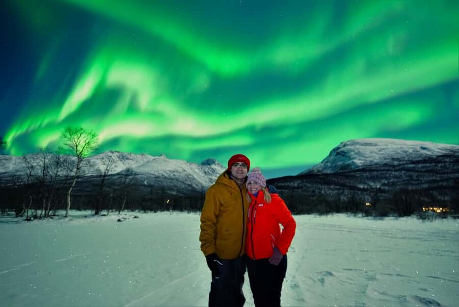 Tromsø: Northern Lights Chase with Free Photos - Meeting the guide outside Tromsø Tourist Shop